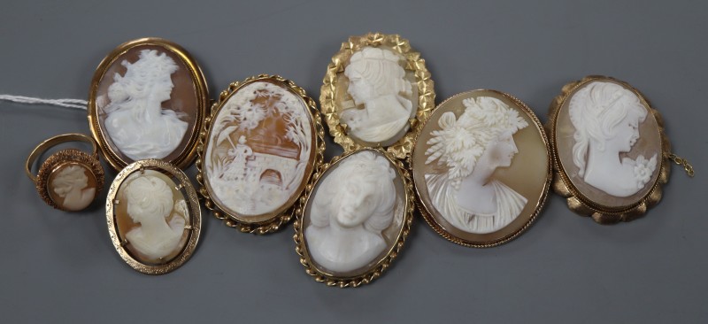 Seven assorted modern yellow metal mounted oval cameo shell brooches, five stamped 9ct and a yellow metal cameo ring.